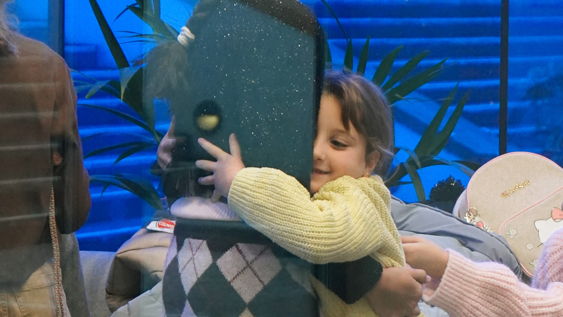 A child sharing a warm hug